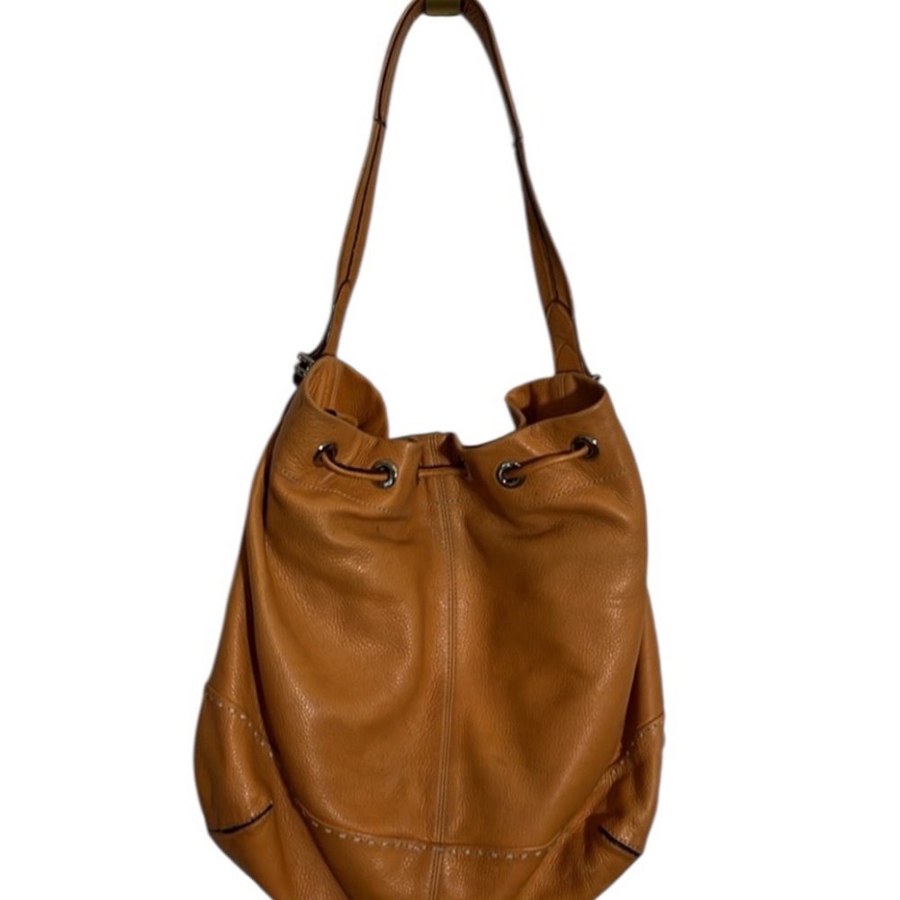 Cole Haan coral / orange  leather bucket bag lots of pockets cinch clossure